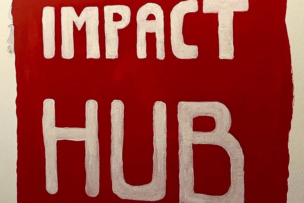 Large sign that says "Impact Hub"