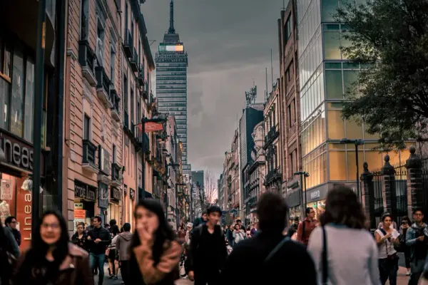 Mexico City as seen in the evening with a cloudy sky and crowds of people